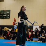 Teenage Championship Martial Arts student practicing weapons