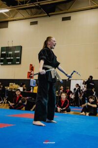 Teenage Championship Martial Arts student practicing weapons